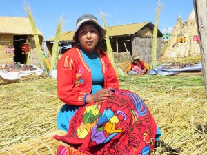Young woman knitting on the Floating Islands of Uros on Lake Titikaka--2